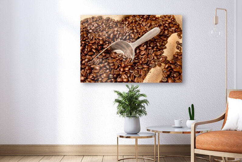 Coffee beans in burlap sack with scoop by Joe Belanger