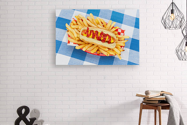 Hotdog with ketchup and mustard by Joe Belanger
