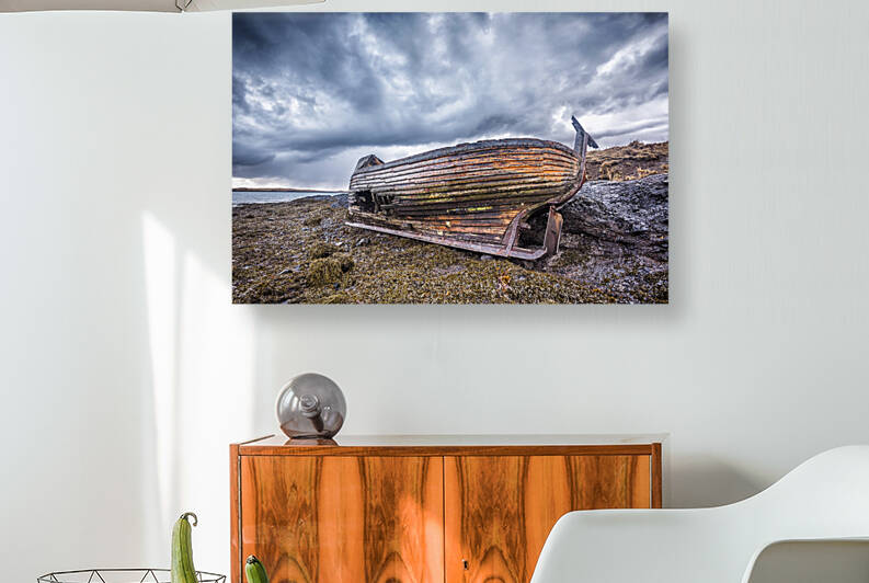 Old wooden ship on beach by Joe Belanger