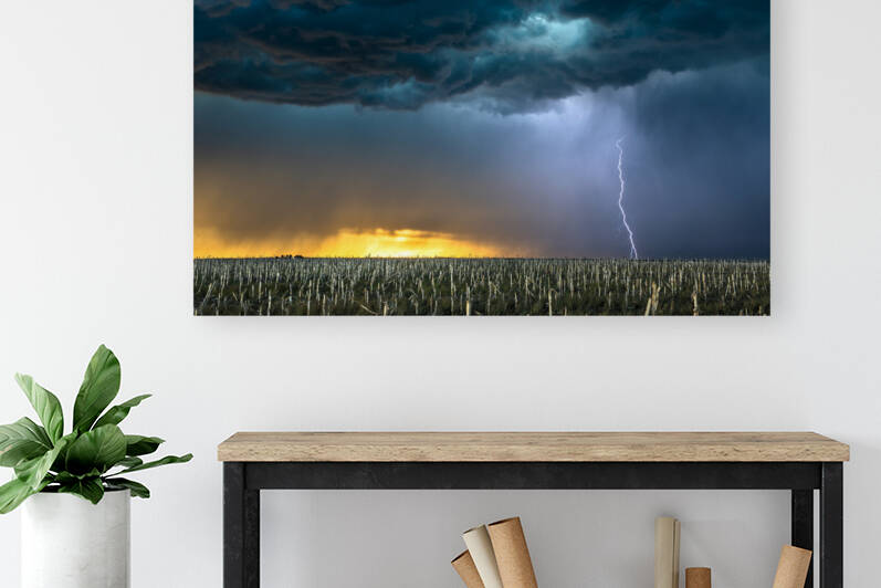 Lightning storm over field in Oklahoma by Joe Belanger