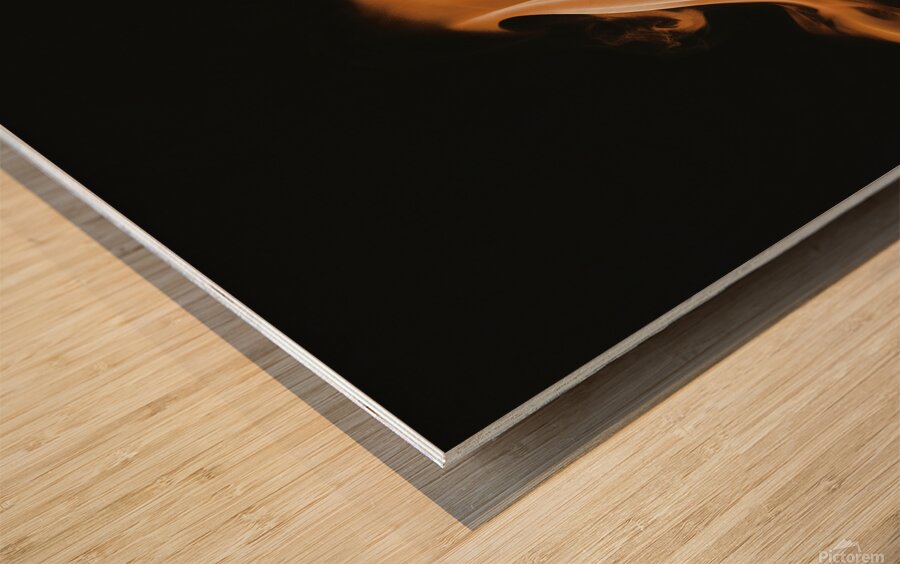 large orange flame on a black background Wood print