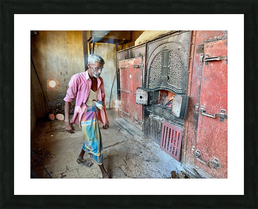 Man Fuelling Up the Fire Picture Frame print