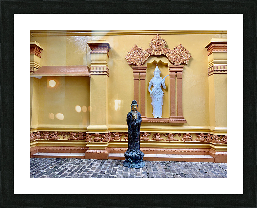 Statues on a Yellow Wall Picture Frame print
