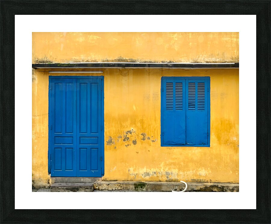 The Yellow House with Blue Windows and Door Picture Frame print