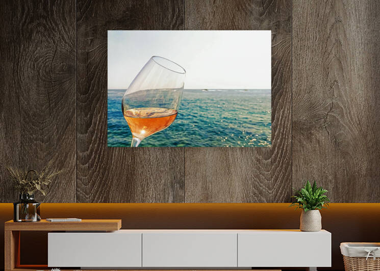 Glass of rose wine on the seacoast of Mediterranean by sergiopazorama
