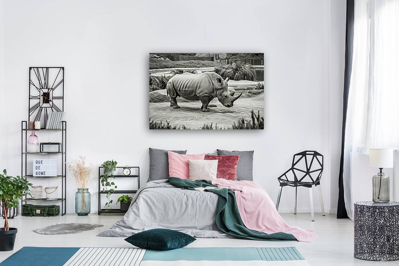 A rhinoceros in what appears to be a zoo or wildl Reproduction