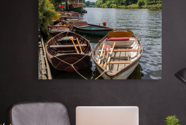 Wooden boats for hire moored on the River Thames by Milton Cogheil