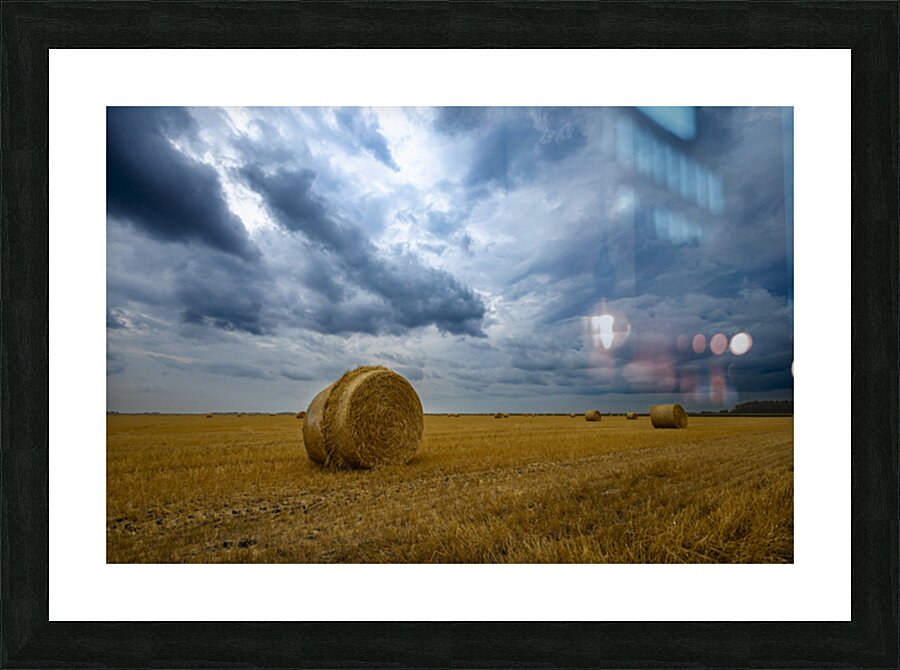 Hay Bales Under a Cloudy Sky Picture Frame print