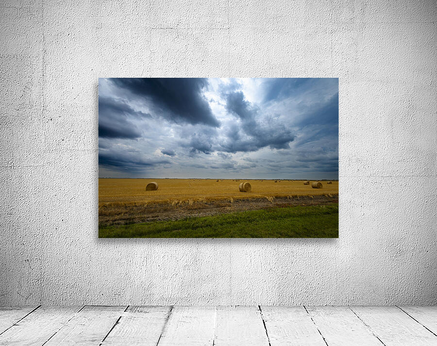 Hay Bales Under a Cloudy Sky Wall Preview