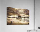 Woman walking dog on stormy beach Acrylic Print