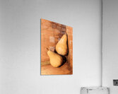 Yellow colored pears on wooden background Acrylic Print