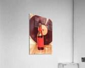 Beer bottle on bar counter top with vinyl record Acrylic Print