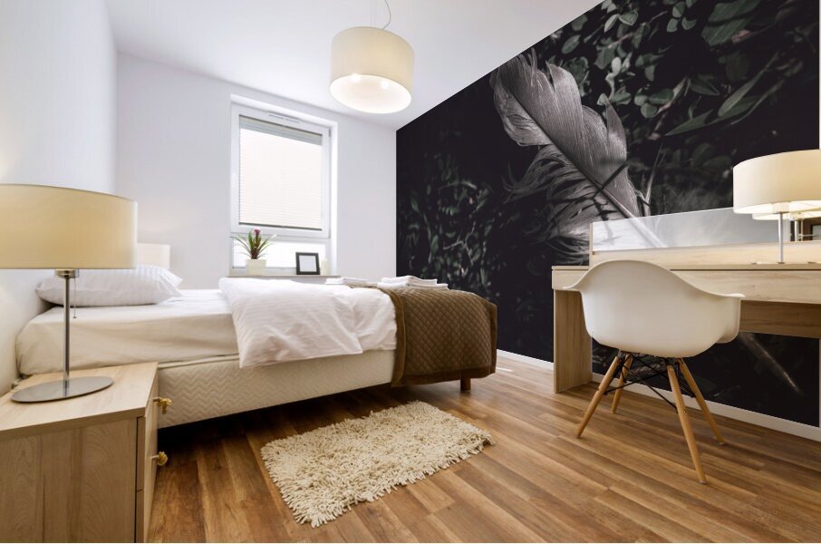 Feather quill lying in green grass. Writers guild  Mural print