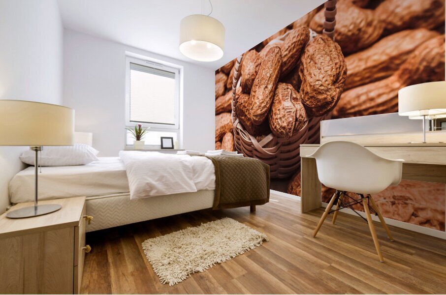 Peanuts in tiny basket in close-up Mural print