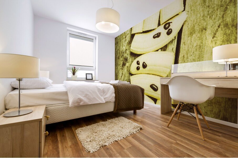 Bananas with painted chocolate faces Mural print