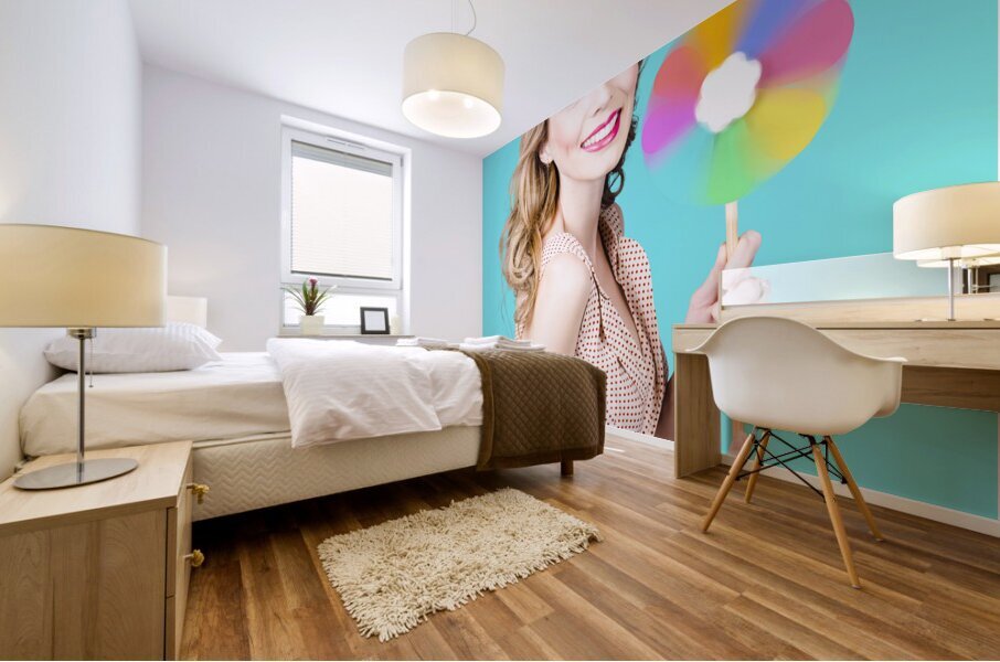 Blonde girl holding windmill fan. Natural energy Mural print