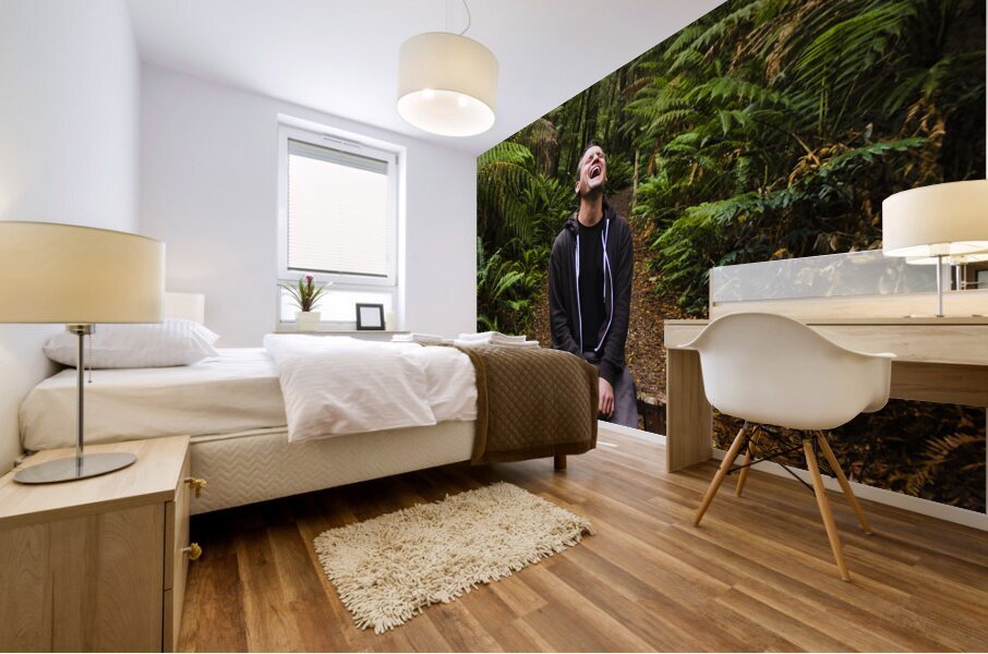 Travel man laughing in Tasmania rainforest Mural print