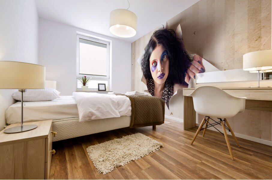 Beautiful female jester breaking out of wallpaper Mural print