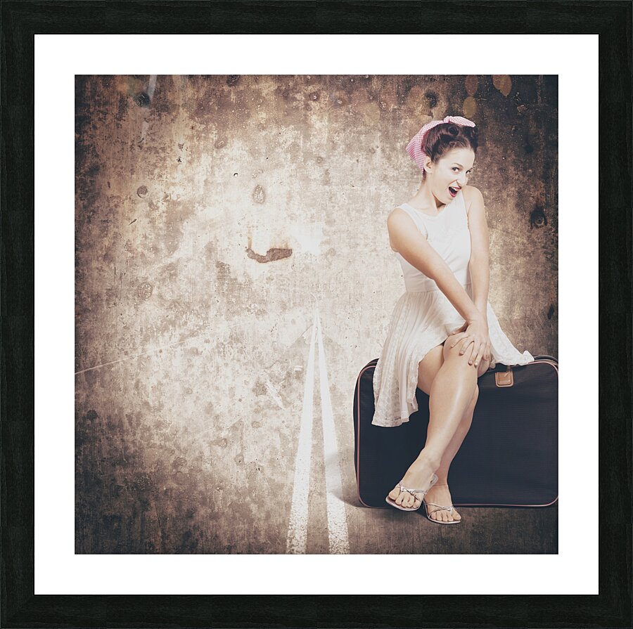 Young hitchhiking pin-up woman on vintage suitcase Picture Frame print