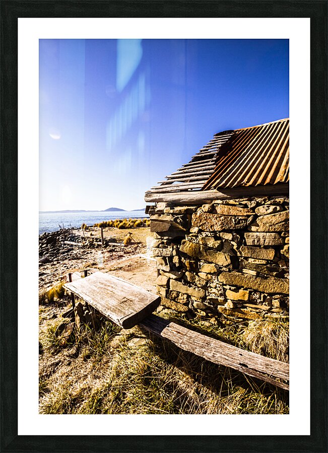 Old stone coastal boat house Picture Frame print