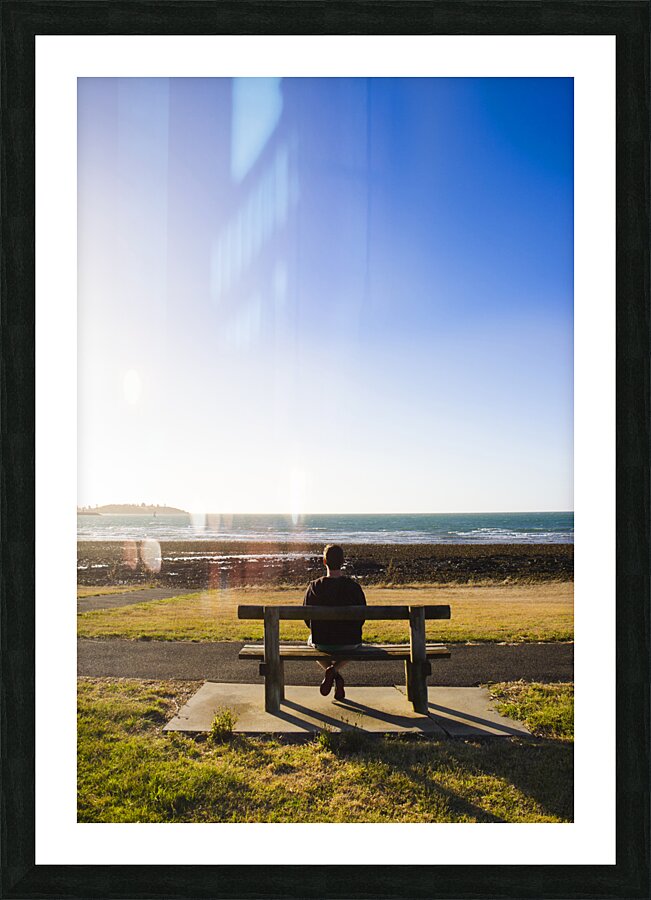 Male tourist enjoying ocean landscape sunset Picture Frame print