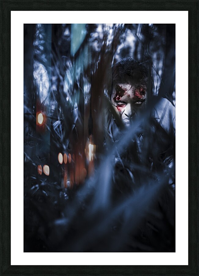 Evil man hiding in silence at dark forest  Picture Frame print