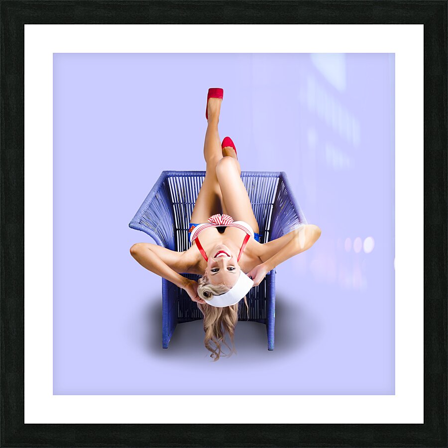 American pinup woman upside down on cane chair Picture Frame print