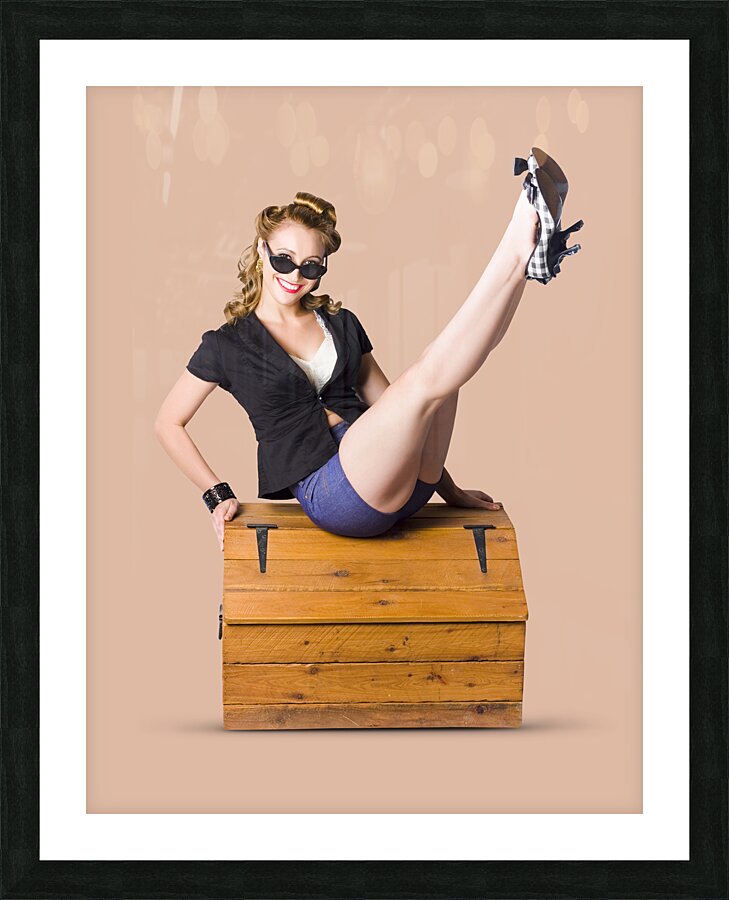 Pin-up seated on a pine trunk Picture Frame print