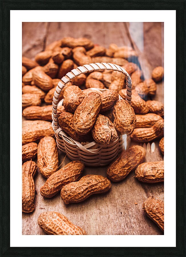 Peanuts in tiny basket in close-up Picture Frame print