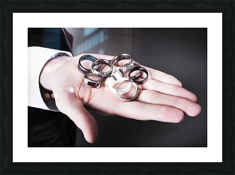 Man displaying a selection of stylish rings Picture Frame print