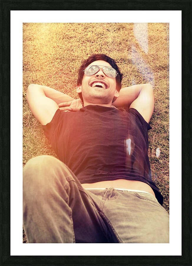 Happy man laughing while enjoying summer holidays Picture Frame print