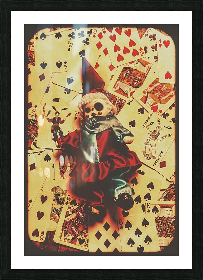 Evil clown doll on playing cards Picture Frame print