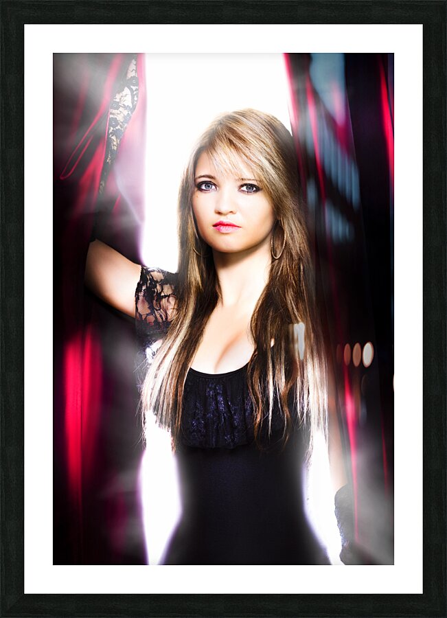 Female performer behind the stage curtain light Picture Frame print