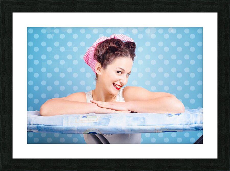 Happy 60s pinup housewife on blue ironing board Picture Frame print