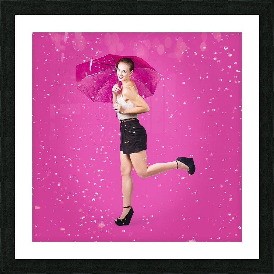 Smiling female model dancing in falling rain Picture Frame print