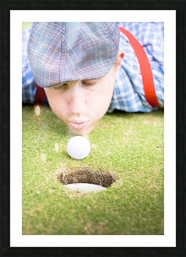 Golf Player Blowing The Ball Picture Frame print