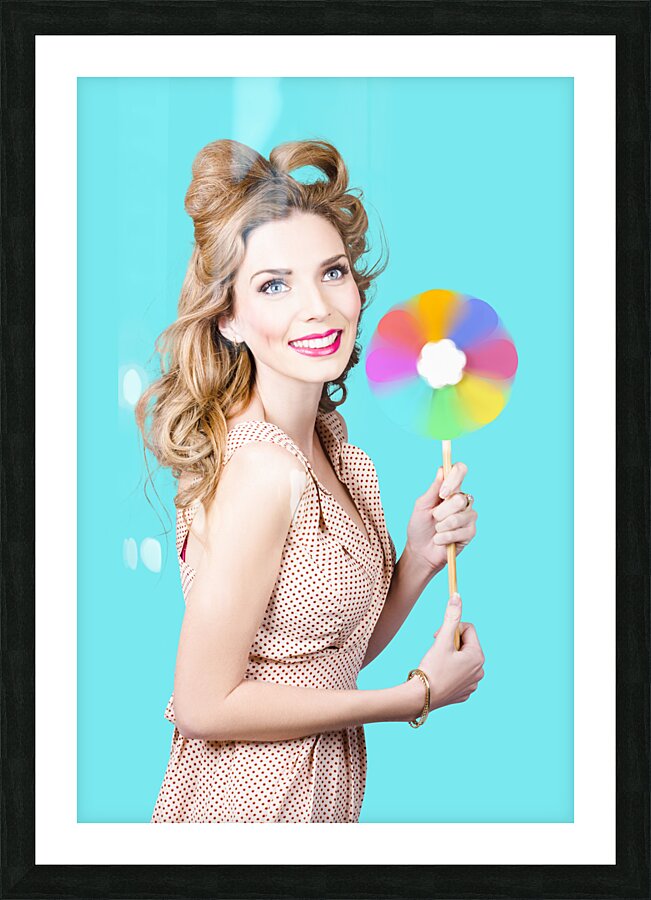 Blonde girl holding windmill fan. Natural energy Picture Frame print