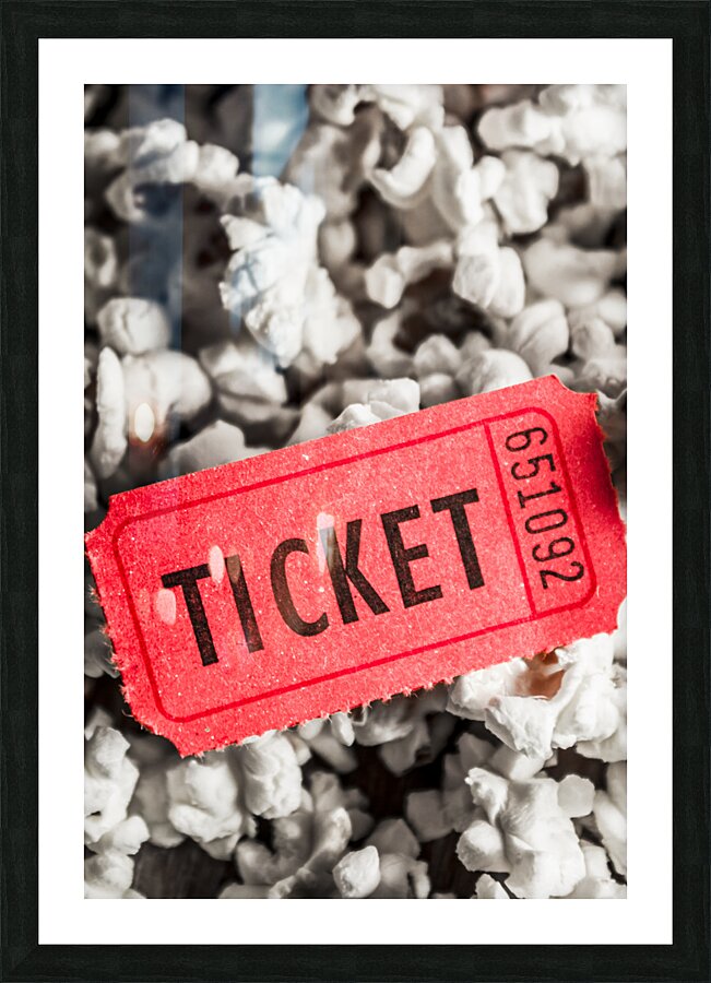 Event ticket lying on pile of popcorn Picture Frame print