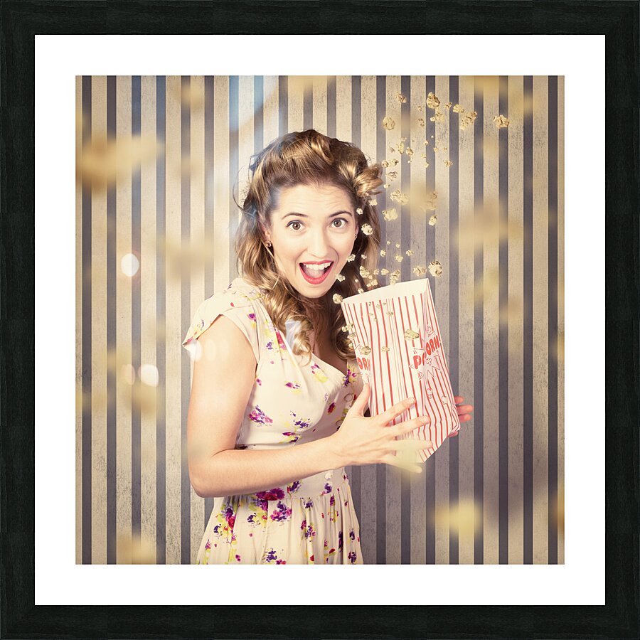 Young girl at the cinema watching halloween movie Picture Frame print