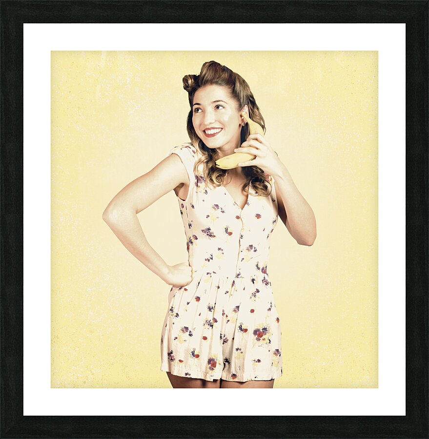Funny pin-up model in conversation on banana phone Picture Frame print