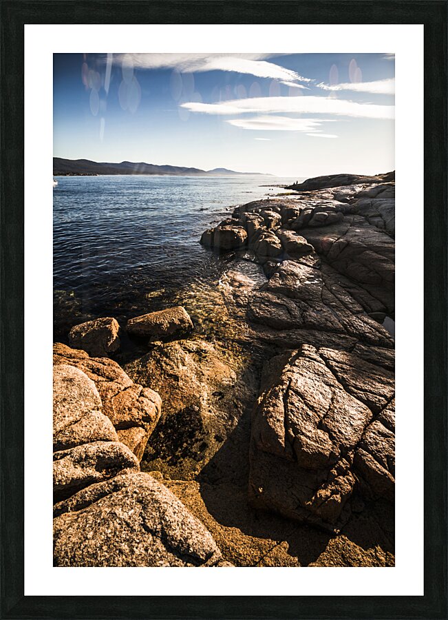 Beautiful rock covered coastline Picture Frame print