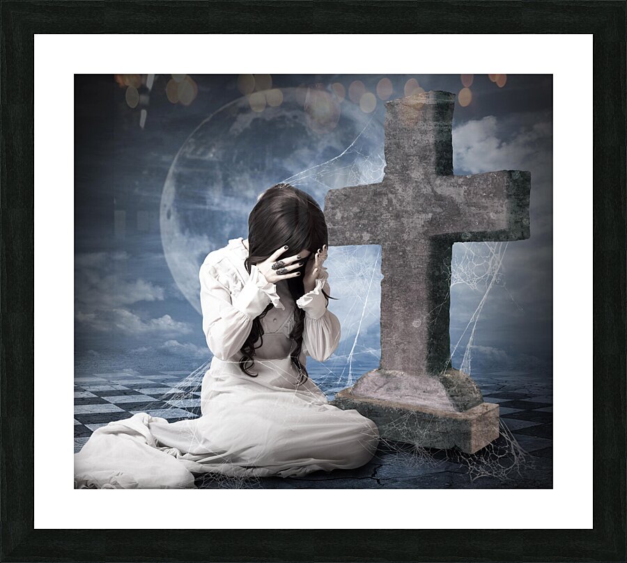 Grieving gothic girl crying next to gravestone Picture Frame print