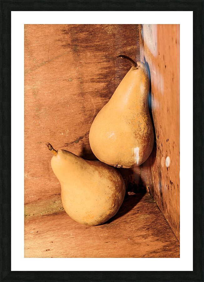 Yellow colored pears on wooden background Picture Frame print