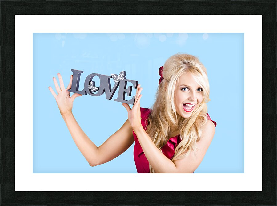 Fun blonde woman with love word sign Picture Frame print