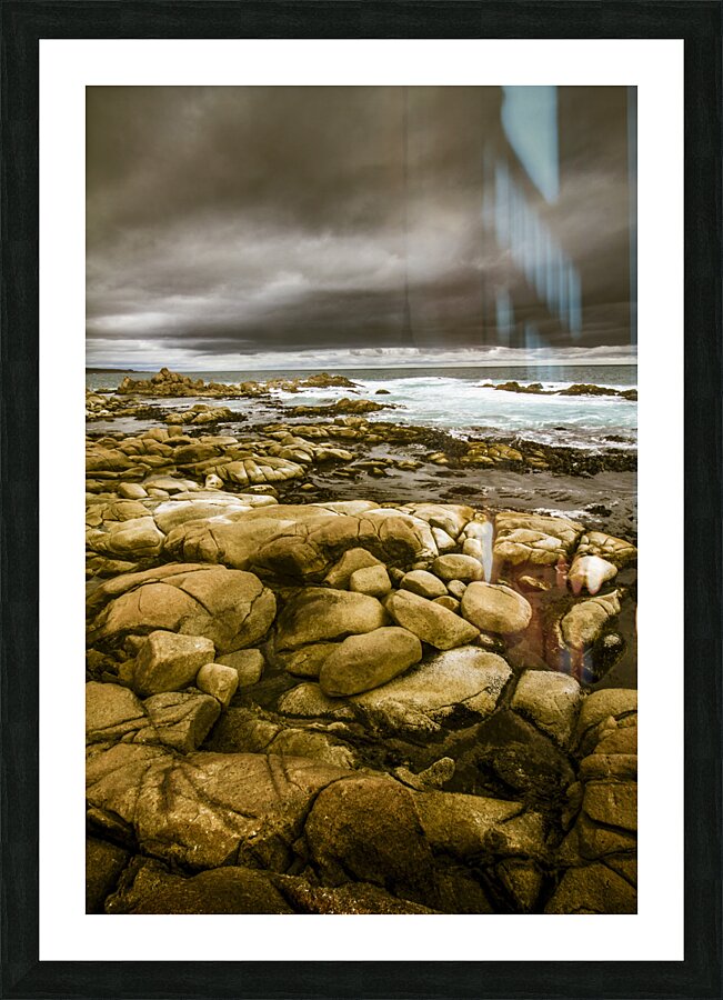 Dark skies on ocean shores Picture Frame print