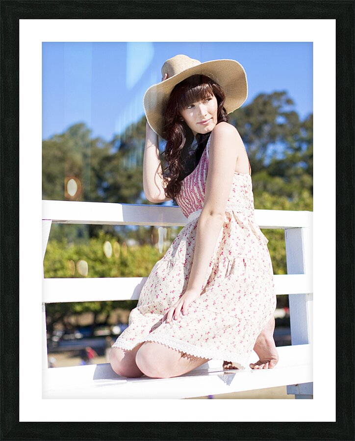 Portrait Of A Smiling Woman Resting On A Pier Bench Picture Frame print
