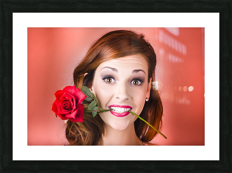 Woman gripping red rose between her teeth Picture Frame print