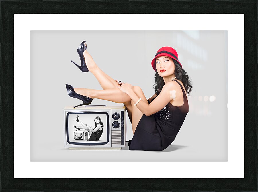 Lovely asian pinup girl posing on vintage tv set Picture Frame print