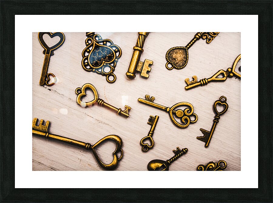 Metal keys of different size on wooden table Picture Frame print