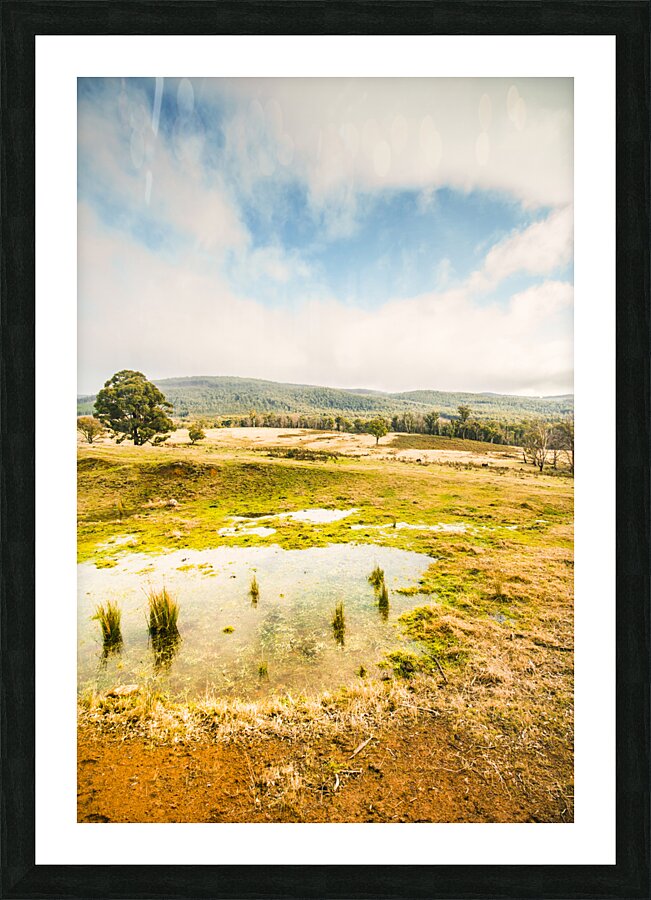 Puddled fields and distant hills Picture Frame print